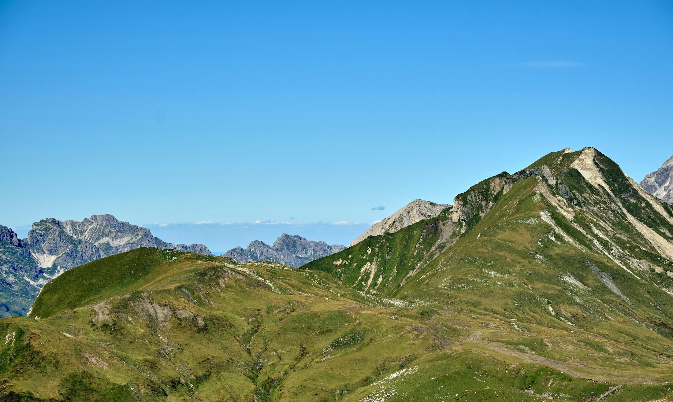 Rolling green hills and mountains in the Arlberg region