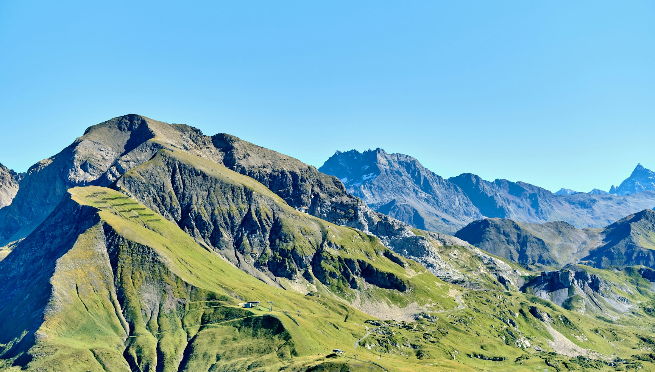 Green mountains under a blue sky in the Arlberg region