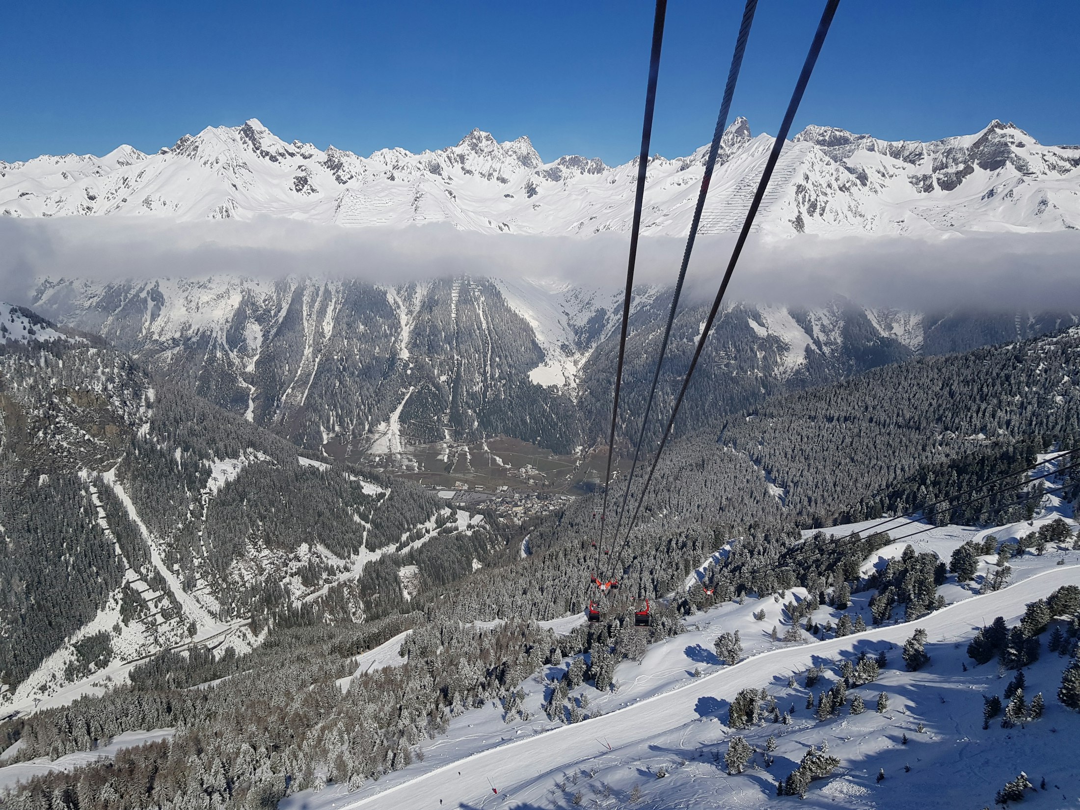 Ski lift climbing a mountain in the Alps